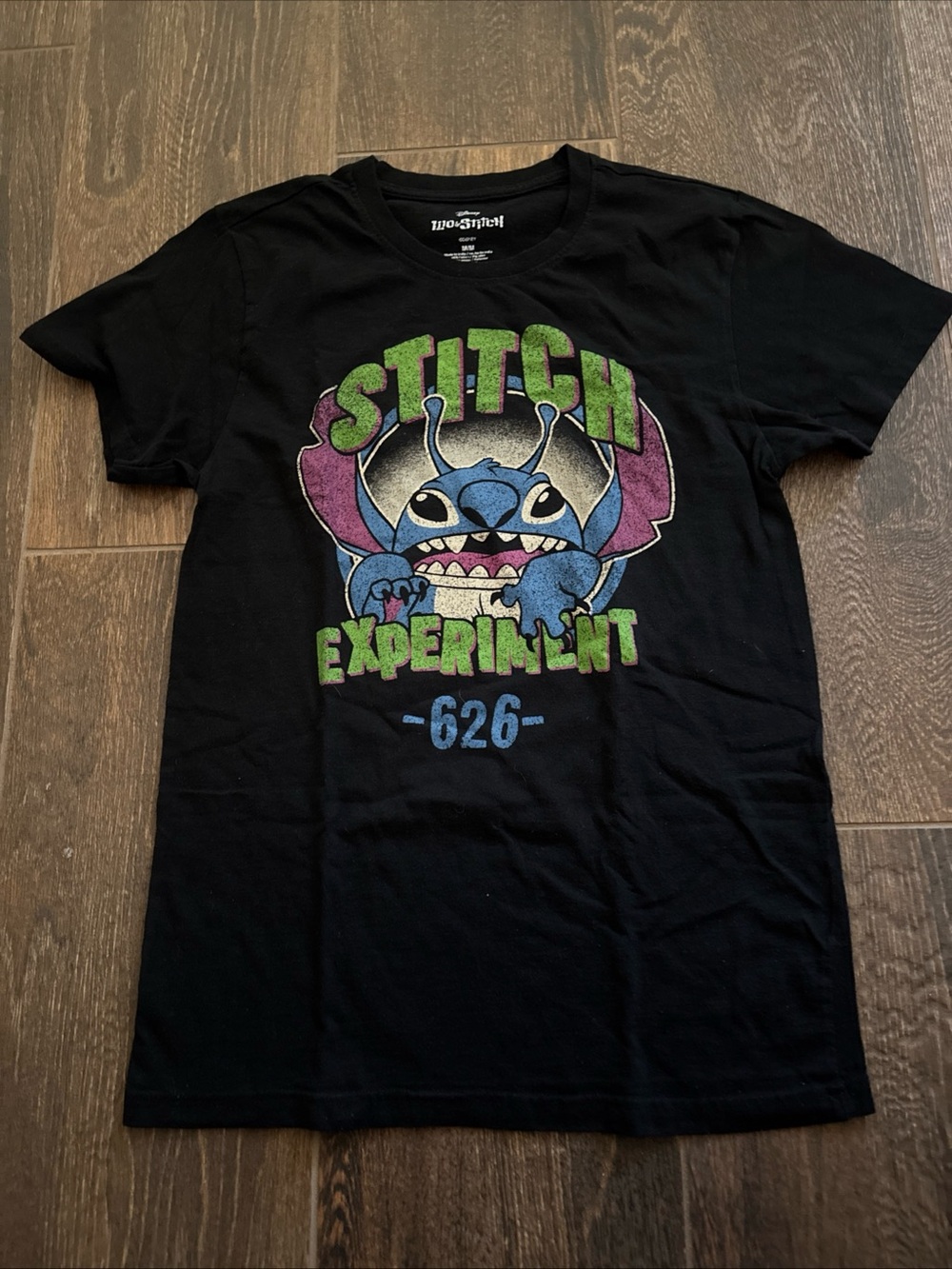 Disney Black Stitch Graphic Tee with Blue, Green & Purple Art